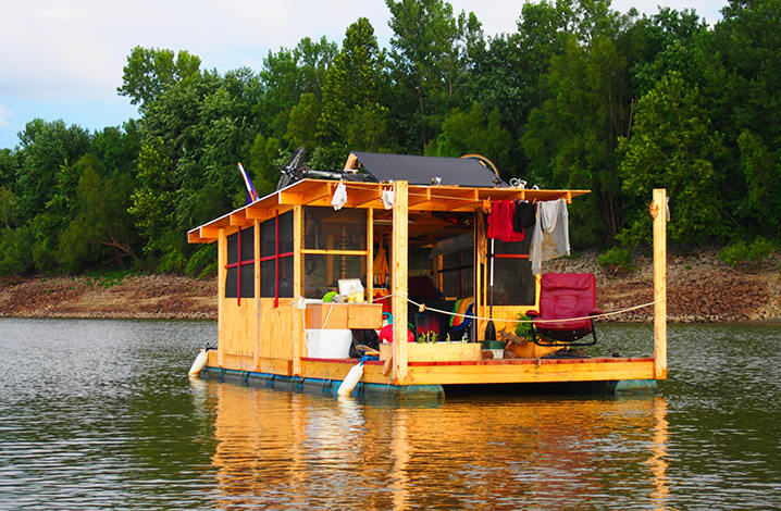 Floating House Rafts Along The River